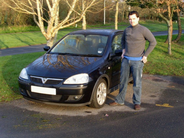 Me and our rental car, the black, 1.4L Vauxhall Corsa.